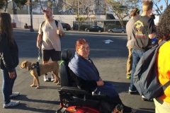 Maria, homeless women in an electric wheelchair, waiting for food on Easter downtown San Diego