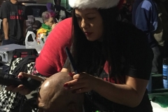 Part 4 - Tammy cutting a homeless man's hair during the Streets of Hope Christmas event.