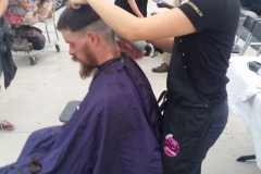 Laura cutting San Diego homeless man's hair