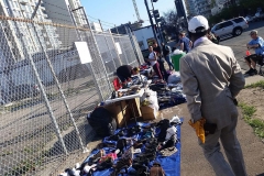 The homeless wait on the streets before we pass out clothes