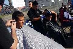 Getting a trim and a haircut for the homeless on the streets of San Diego.
