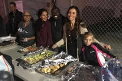 Christina, Venice, Conrad, Marta and little Aryana serving the homeless food in the food line.