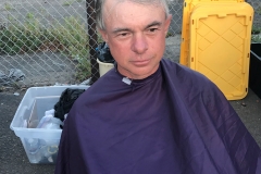 A homeless man ready to get his haircut downtown