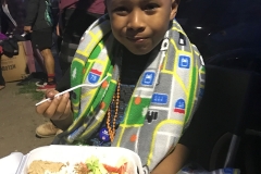 Santos enjoying a free meal after a great haircut