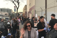 Tammany waves hello as she serves the homeless in downtown San Diego.