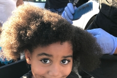 Little homeless girl Lauren has her hair cut for the first time ever on the streets.
