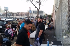 With the haircut team done for the night, the food line tables are being set up to feed the homeless.