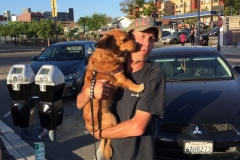 Homeless dog getting a hug on Easter downtown San Diego