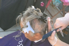 San Diego homeless women getting her hair cut on Easter