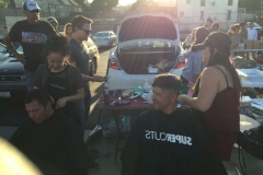 Rays of sun spraying the homeless hair cutters on Easter