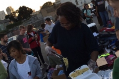 Scooping out spaghetti during our San Diego Easter homeless event