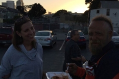 Anne and Chris eating food during our San Diego Easter homeless event