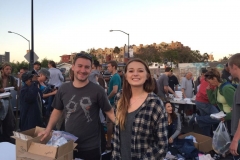 Joe and Amanda making toiletries bags for San Diego homeless