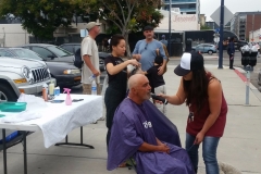 Tammy trims a San Diego homeless man's beard