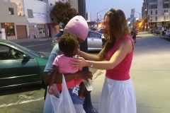 Homeless One Year Old Christiana and Hannah praying with Marta.