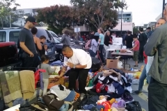 Taking inventory of all the San Diego homeless clothing donations.