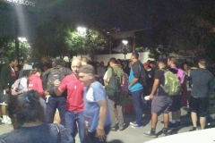 San Diego homeless gathering around the clothing donations.