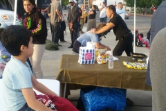 Zayden watching David give a homeless massage.