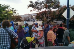 San Diego's homeless start lining up for a meal to be served.