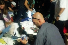 Volunteer Curtis going through toiletries for the homeless.