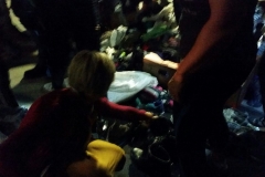 A volunteer search through the homeless clothing donations.