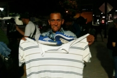 San Diego homeless man new shoes and shirt.