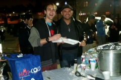 Nate and Eric preparing food plates for the homeless at our Thanksgiving event.