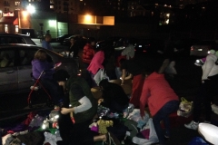 Passing out clothing and other donations at the Streets of Hope San Diego Homeless Thanksgiving event.
