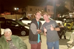 Nate and Parker give a thumbs up during the San Diego Thanksgiving homeless event, with our homeless friend Bob in his wheelchair.
