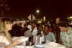 Suzy passing out food plates to San Diego's homeless for Thanksgiving.