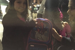 Little homeless girl Rickie loves her Spiderman backpack and blanket from Arul.