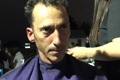 Tammy cutting a homeless man's hair at the Streets of Hope Christmas event.