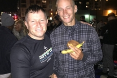 David, massage therapist for the homeless, shakes Johnathan's hand at the Streets of Hope Christmas event.
