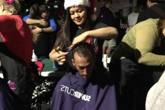 Tammy cuts a homeless man's hair.