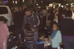 Children volunteers of the Streets of Hope help with their parents pass out clothing to the homeless.