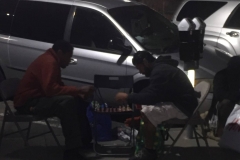 Two San Diego homeless men play chess at the Streets of Hope Christmas Event.