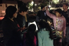 Dan read from the bible to a bunch of the Streets of Hope San Diego volunteers and their kids.
