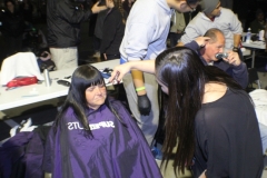 Tammy cuts a homeless women's hair on the streets of San Diego.