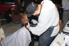 Getting a professional haircut for the homeless on the streets of San Diego.