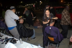 Tammy gives a homless man a haircut on the Streets of Hope special event.