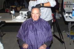 Giving a homeless man a haircut.