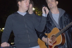Dan and Chris sing worship songs before the meal is served.