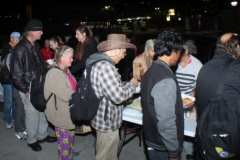 The homeless food line is really moving as people are getting feed.