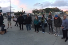 The Streets of Hope volunteers circle up to begin passing out food to the homeless