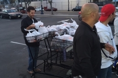 Jeremy counting the bags of food ready to given to the homeless
