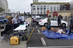 Setting up early on the streets of San Diego to cut the hair of the homeless.