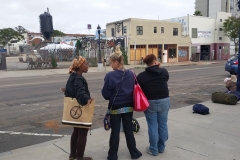 Some homeless women waiting for a haircut on the streets in downtown San Diego.