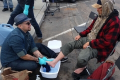 Washing a homeless man's feet at our Easter event in downtown San Diego