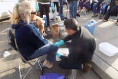 Washing the feet of a homeless women for Easter on the streets of San Diego.