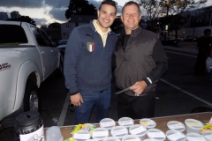 Carlos and David at the Lids of Encouragement table for the homeless.